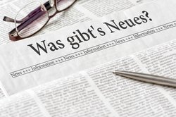 Zeitung mit der Überschrift Was gibts Neues
